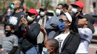 In this May 7, 2020, file photo, protesters listen during a rally after the shooting of Dreasjon Reed outside of the City County Building in Indianapolis.
