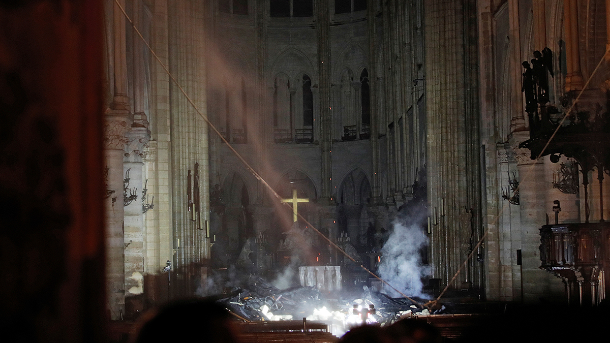 Smoke is seen in the interior of Notre Dame cathedral in Paris, Monday, April 15, 2019. A catastrophic fire engulfed the upper reaches of Paris' soaring Notre Dame Cathedral as it was undergoing renovations Monday, threatening one of the greatest architectural treasures of the Western world as tourists and Parisians looked on aghast from the streets below.