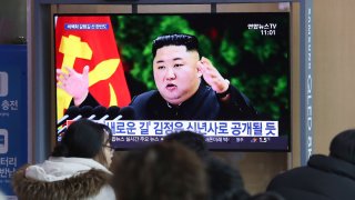 People watch a TV screen showing an image of North Korean leader Kim Jong Un during a news program at the Seoul Railway Station in Seoul, South Korea, Sunday, Dec. 29, 2019.