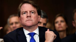 In this Sept. 27, 2018, file photo, White House counsel Don McGahn listens as Supreme court nominee Brett Kavanaugh testifies before the Senate Judiciary Committee on Capitol Hill in Washington.