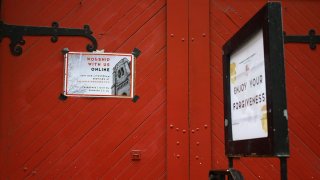 A flyer about online worship services is posted outside the Calvary Church during the coronavirus pandemic on May 6, 2020, in New York City.