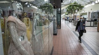 A shopper wears a protective mask inside the Yuba Sutter Mall in Yuba City, California, May 13, 2020.