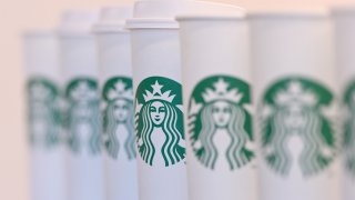 In this Feb. 18, 2016, file photo, a collection of venti sized Starbucks take away cups are seen in London, England.