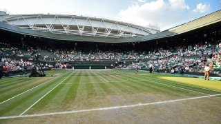A general view of the state of the grass on centre court on the final day of the 2018 Wimbledon Championships at The All England Lawn Tennis Club in Wimbledon, southwest London, on July 15, 2018.