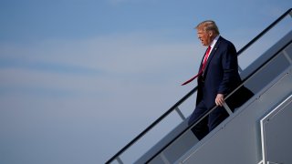 President Donald Trump exits Air Force One as he arrives at Tulsa International Airport on Saturday, June 20, 2020, in Tulsa, Okla.