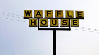 Waffle House restaurant sign, Auburn, Ala., July 6, 2018.
