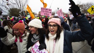 In this Jan. 18, 2020, file photo, Georgetown students, from left, Emma Garman, Annmarie Rotatori and Claire Tebbutt, join the Women's March near the White House in Washington.
