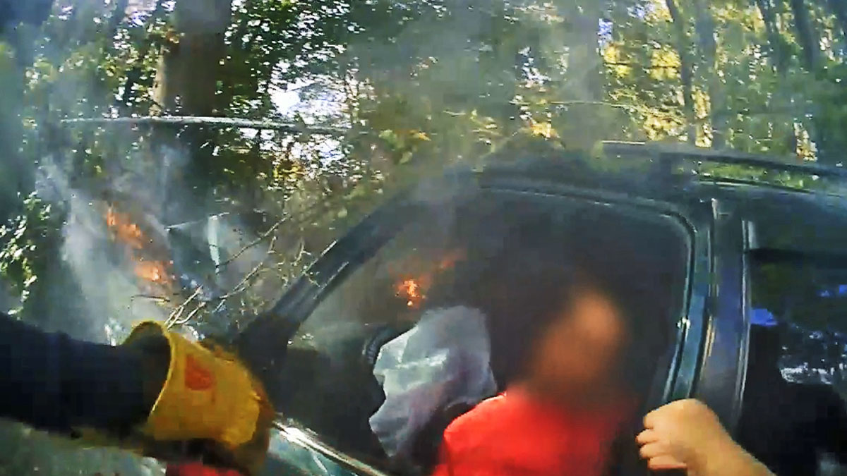 Body Cam Captures Incredible Rescue Of Women From Burning Car In New