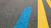 What the blue line painted on some city streets means for the upcoming Chicago Marathon