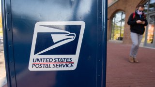 A mailbox is seen outside a United States Postal Service post office