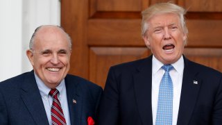 President-elect Donald Trump calls out to media as he and former New York Mayor Rudy Giuliani pose for photographs as Giuliani arrives at the Trump National Golf Club Bedminster clubhouse, Sunday, Nov. 20, 2016, in Bedminster, N.J.. (AP Photo/Carolyn Kaster)