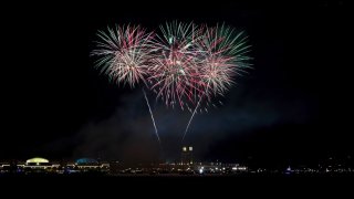 Fireworks illuminate the sky over Navy Pier shores of Lake Michigan during 4th of July celebrations in Chicago,