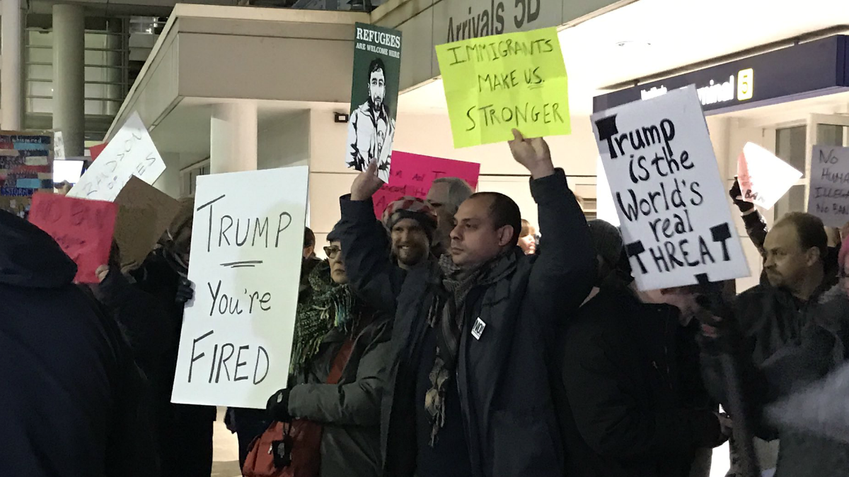 Activists Rally at Chicago’s O’Hare Airport Against Trump’s Order on