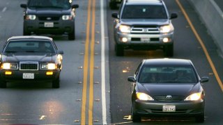 In this Feb. 3, 2005, file photo, cars drive in the High Occupancy Vehicle (HOV) lane (R), also called the diamond or commuter lane, on the 118 or Ronald Reagan Freeway near Simi Valley, California.