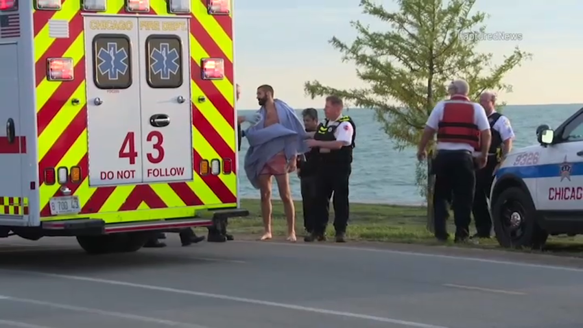 web - men pulled from lake