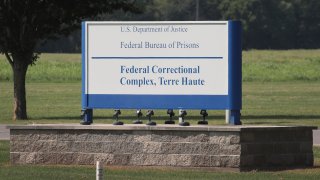 In this July 25, 2019, file photo, a sign marks the entrance to the Federal Correctional Complex Terre Haute in Terre Haute, Indiana.