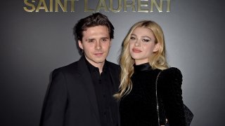 Brooklyn Beckham and Nicola Peltz attend the Saint Laurent fashion show.