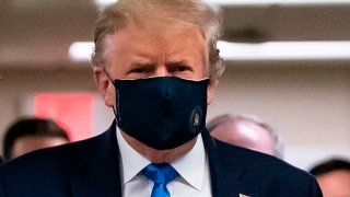 In this July 11, 2020, file photo, President Donald Trump wears a mask as he visits Walter Reed National Military Medical Center in Bethesda, Maryland.