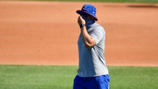 Manager David Ross of the Chicago Cubs instructs during the first season workout at Wrigley Field