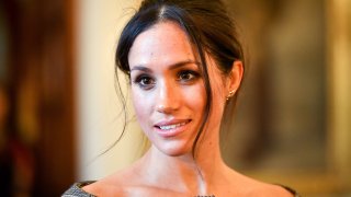 In this Jan. 18, 2018, file photo, Meghan Markle chats with people inside the Drawing Room during a visit to Cardiff Castle in Cardiff, Wales.