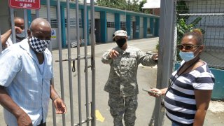 An official turns away two voters at a voting center