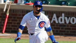 CHICAGO, ILLINOIS – AUGUST 17: Javier Baez #9 of the Chicago Cubs reacts after being hit by his foul ball in the first inning of game one of a doubleheader against the St. Louis Cardinals at Wrigley Field on August 17, 2020 in Chicago, Illinois. (Photo by Nuccio DiNuzzo/Getty Images)