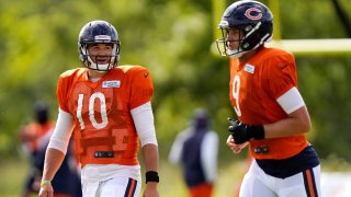 LAKE FOREST, ILLINOIS – AUGUST 18: Mitchell Trubisky #10 of the Chicago Bears talks with Nick Foles #9 during training camp at Halas Hall on August 18, 2020 in Lake Forest, Illinois. (Photo by Nam Y. Huh-Pool/Getty Images)