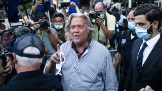 In this Aug. 20, 2020, file photo, Steve Bannon, former U.S. President Donald Trump political strategist, center, departs from federal court in New York.