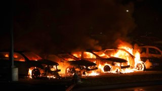 KENOSHA, WISCONSIN, USA – AUGUST 24: Jacob Blake protesters lit vehicles on fire in Kenosha, Wisconsin, United States on August 24, 2020. A police shooting in the US state of Wisconsin sent a Black man into serious condition on Sunday, with the video footage of the incident triggering outrage. (Photo by Tayfun Coskun/Anadolu Agency via Getty Images)
