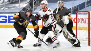 EDMONTON, ALBERTA – AUGUST 11: Jonathan Toews #19 of the Chicago Blackhawks sets a screen in front of goaltender Robin Lehner #90 of the Vegas Golden Knights as Nate Schmidt #88 helps to defend the play in the first period of Game One of the Western Conference First Round of the 2020 NHL Stanley Cup Playoff at Rogers Place on August 11, 2020 in Edmonton, Alberta. (Photo by Andy Devlin/NHLI via Getty Images)