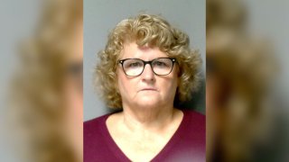 In this handout photo provided by Lansing Police Department, Ex-Michigan State University women's gymnastics coach Kathie Klages poses for a mug shot photo on August 30, 2018 in Lansing, Michigan.