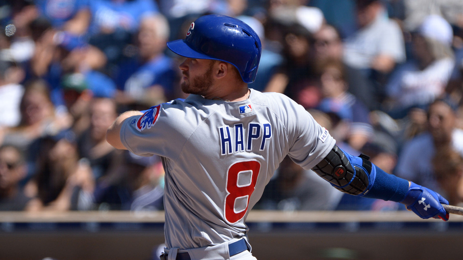 Chicago Cubs' Kyle Schwarber watches his RBI triple off Cincinnati