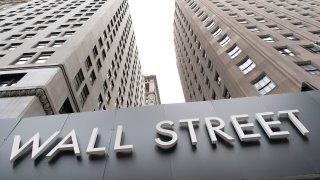 Buildings line Wall Street, Monday, Aug. 31, 2020, in New York.