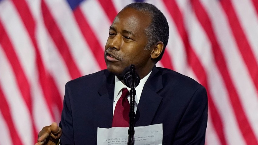 Secretary of Housing and Urban Development Ben Carson holds notes as he speaks during a campaign event before President Donald Trump at the Cobb Galleria Centre, Friday, Sept. 25, 2020, in Atlanta.