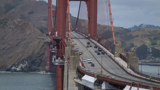 Traffic travels over the Golden Gate Bridge in San Francisco, California