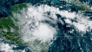 This satellite image released by the National Oceanic and Atmospheric Administration (NOAA) shows Tropical Storm Nana approaching Belize, Wednesday, Sept. 2, 2020. The storm strengthened to a hurricane late Wednesday night.