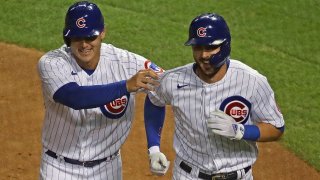 Anthony Rizzo and Kris Bryant celebrate scoring against the Cardinals on September 4th.