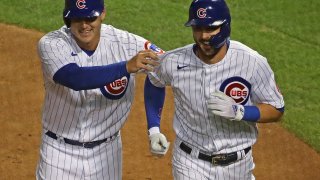 Anthony Rizzo and Kris Bryant celebrate scoring against the Cardinals on September 4th.