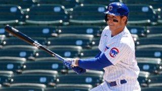 Anthony Rizzo watches a double off his bat in a Cubs game vs the Cardinals