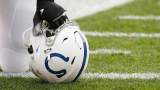 An Indianapolis Colts helmet sits on the turf prior to an NFL game between the Indianapolis Colts and the Cleveland Browns on Oct. 11, 2020, at FirstEnergy Stadium in Cleveland, Ohio.