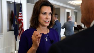Michigan Governor Gretchen Whitmer speaks to a reporter