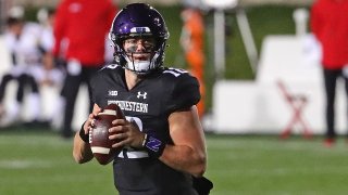 Peyton Ramsey #12 of the Northwestern Wildcats looks for a receiver against the Maryland Terrapins at Ryan Field on October 24, 2020 in Evanston, Illinois