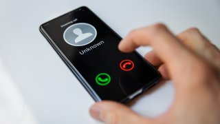 smartphone with incoming call from unknown person