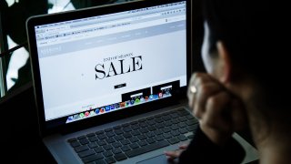 A shopper browses the internet for deals.