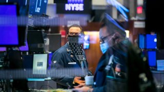 Traders work the floor of the New York Stock Exchange.