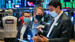 Traders work the floor of the New York Stock Exchange.