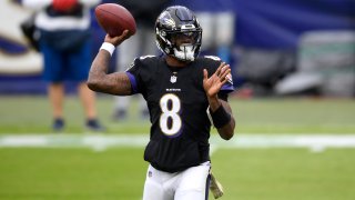 Baltimore Ravens quarterback Lamar Jackson throws a pass
