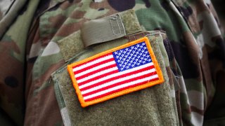 An American flag patch is seen on the uniform of a U.S. Army soldier during a ceremony in Krakow, Poland, Aug. 4, 2020.