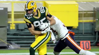 Robert Tonyan #85 of the Green Bay Packers catches a pass for a touchdown as Eddie Jackson #39 of the Chicago Bears defends during the 2nd half of the game at Lambeau Field on November 29, 2020 in Green Bay, Wisconsin.