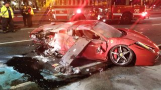 A Ferrari sports car flipped over on Lake Shore Drive November 28 and caught fire, police said